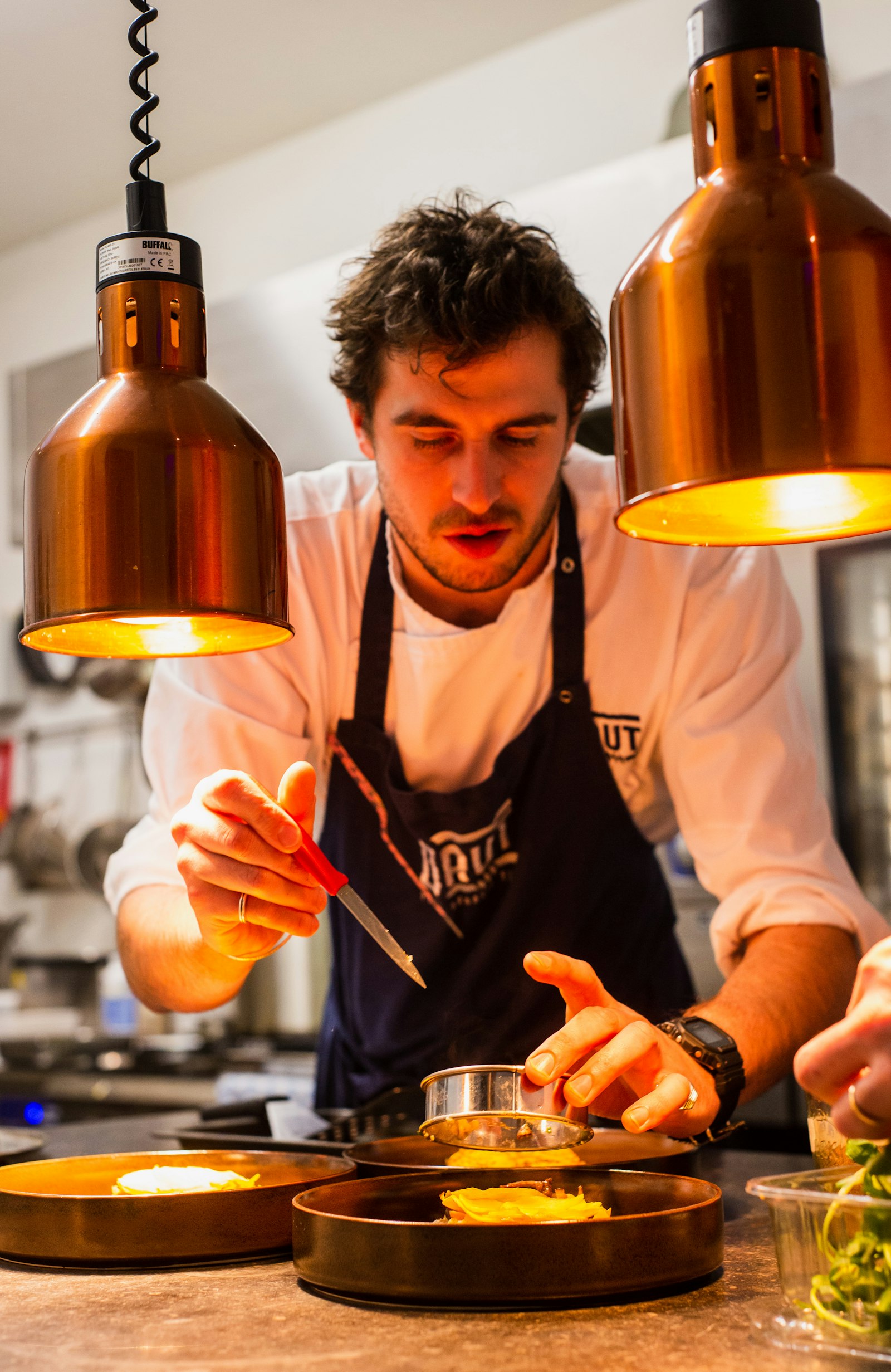 Chef plating in the kitchen